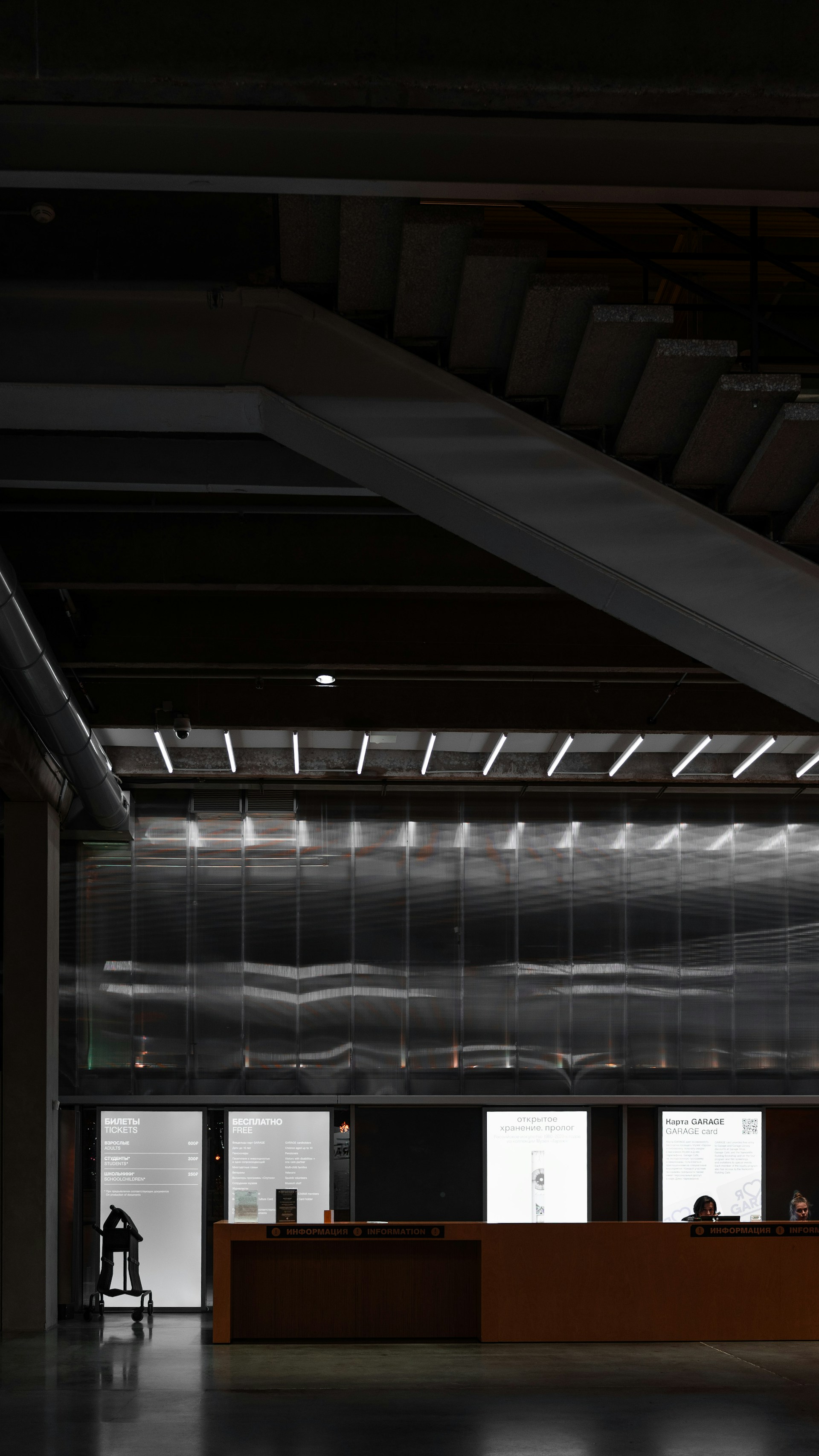 Modern office reception area with staircase and clean interior design