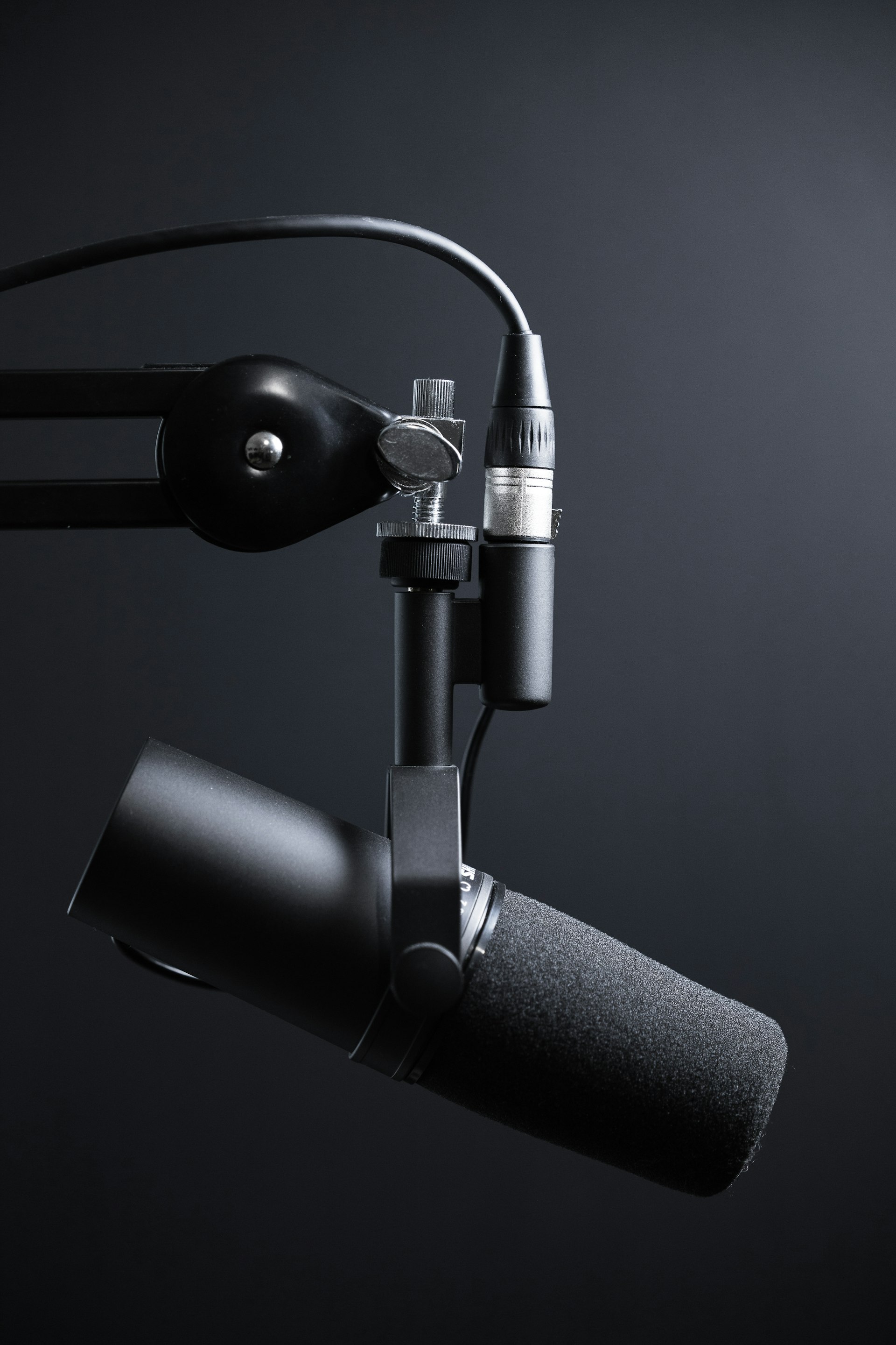 Professional podcast microphone and recording equipment in a studio