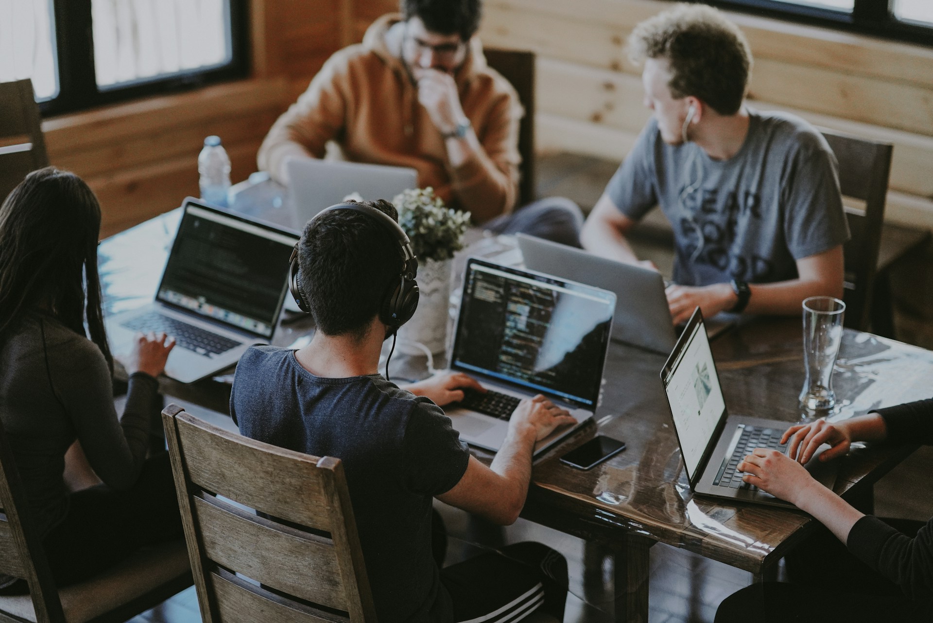 Business professional analyzing call data and metrics on a laptop for voice AI optimization