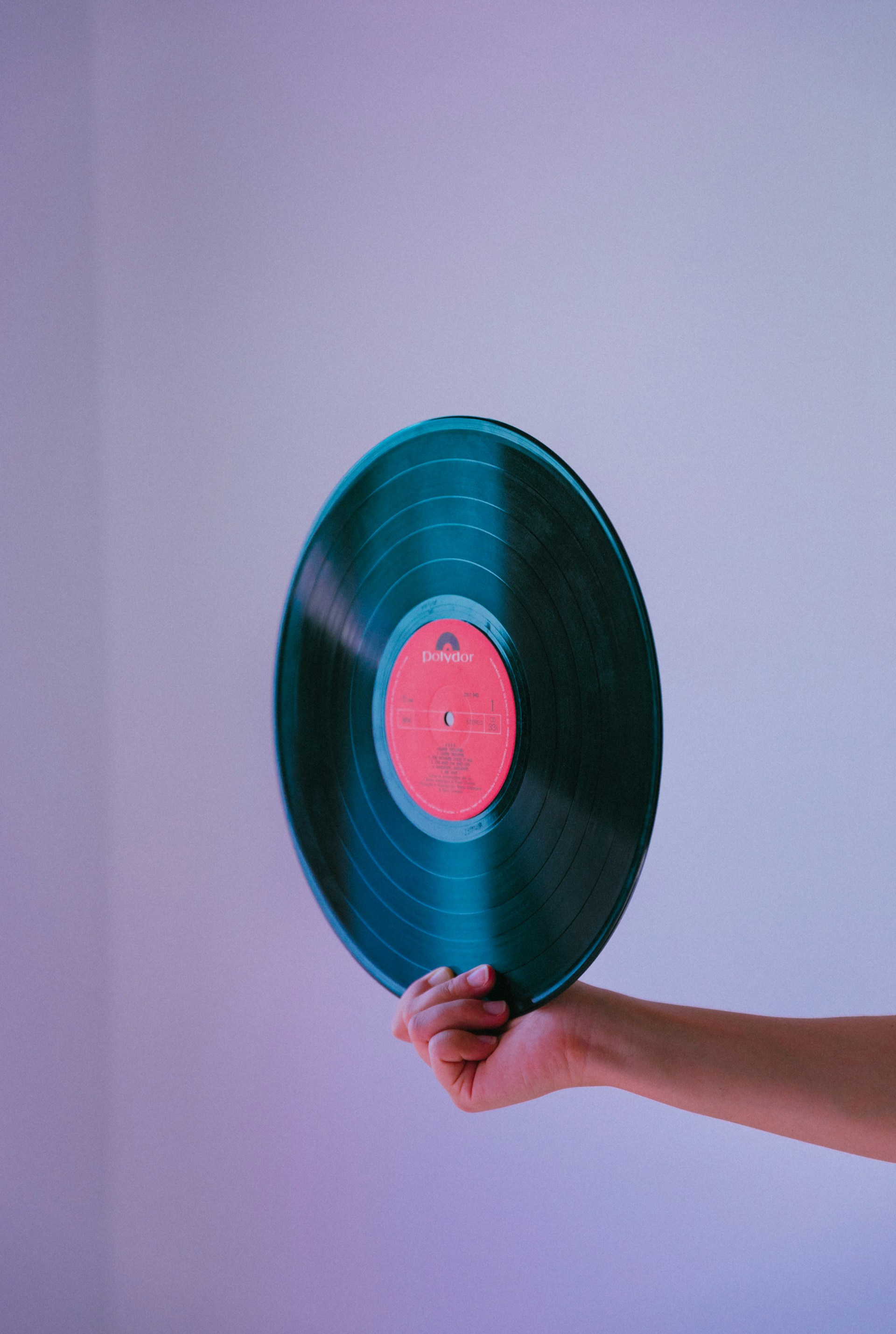 Sound waves visualized in purple and green colors on dark background