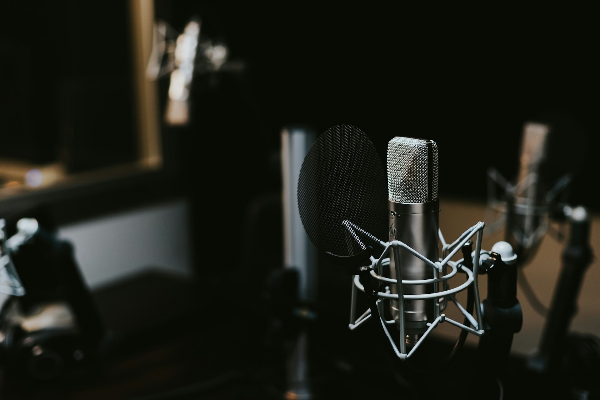 Content creator recording in a home studio environment with camera and equipment