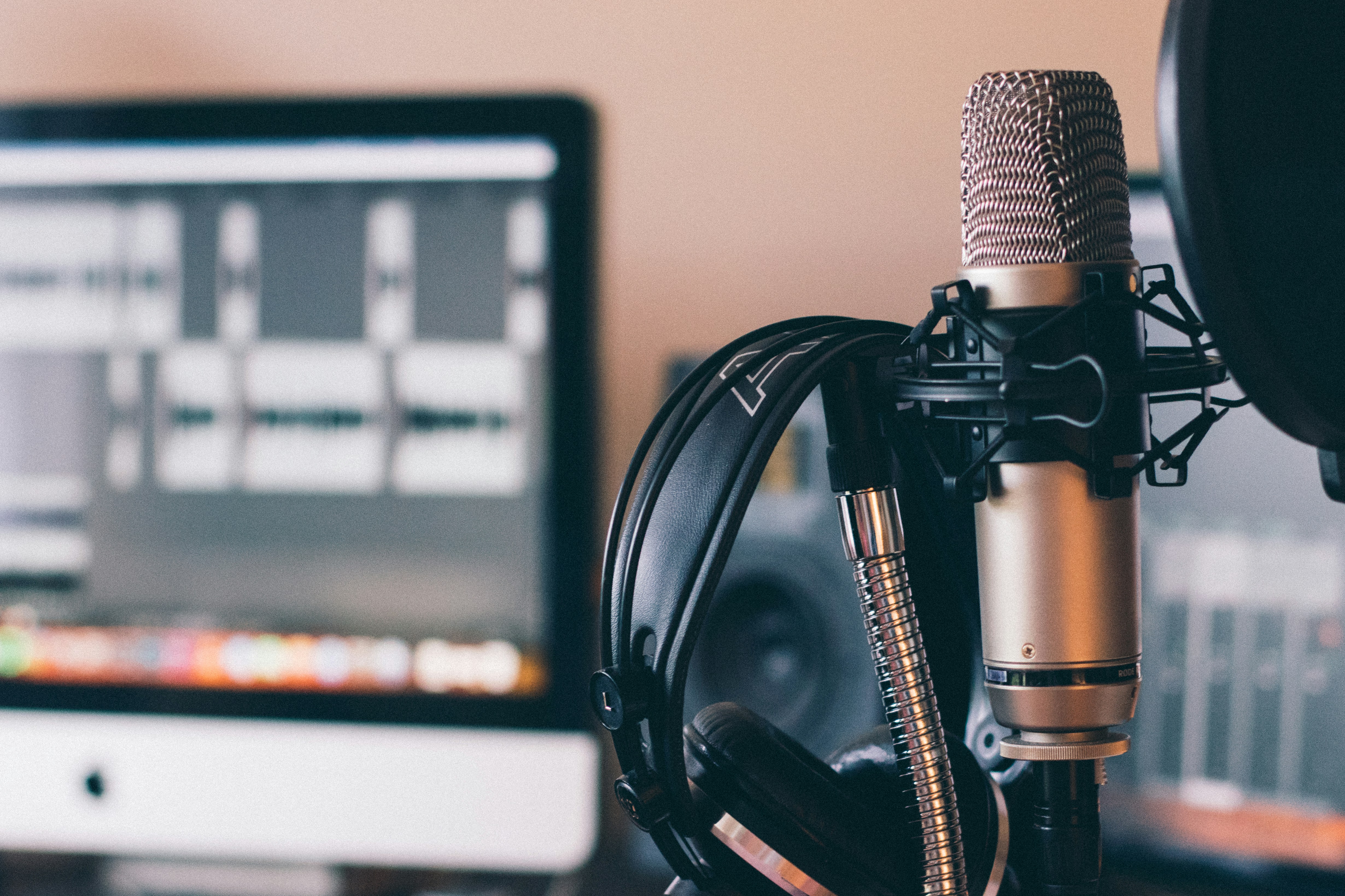 Social media influencer in home studio recording podcast content