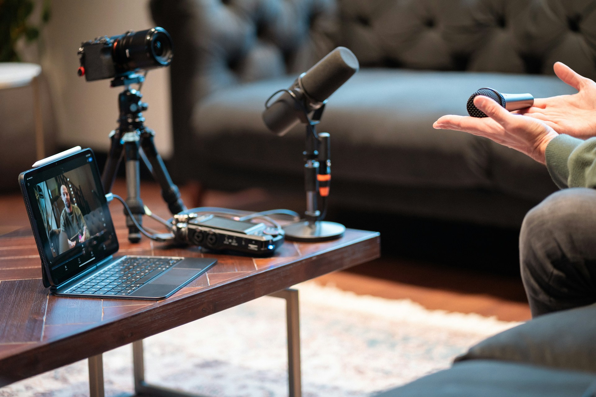 Pakistani content creator recording with microphone and headphones