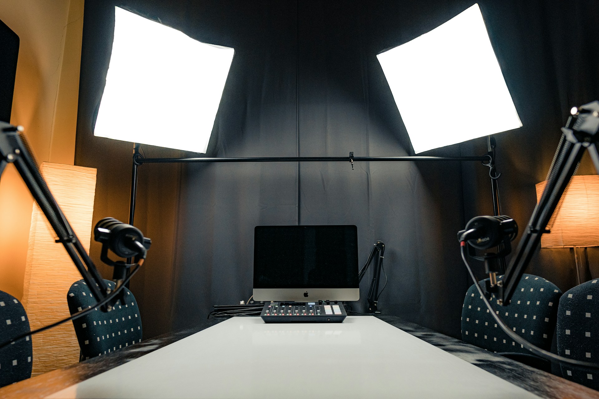 Professional podcast studio setup with dual Rode microphones and mixer